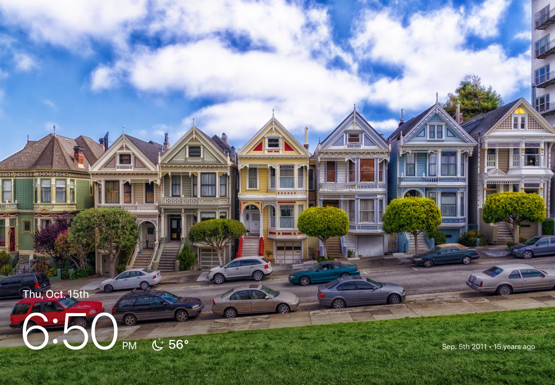 A row of colorful Victorian houses filling the screen, with a photo caption reading 15 years ago.